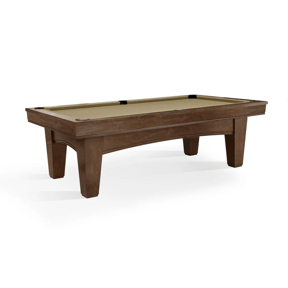 Modern Brunswick Winfield pool table (8 ft) shown from a slightly elevated angle against a white background. Dark wood with a nutmeg finish, light brown-green playing surface, sturdy legs, curved frame, black leather pockets.