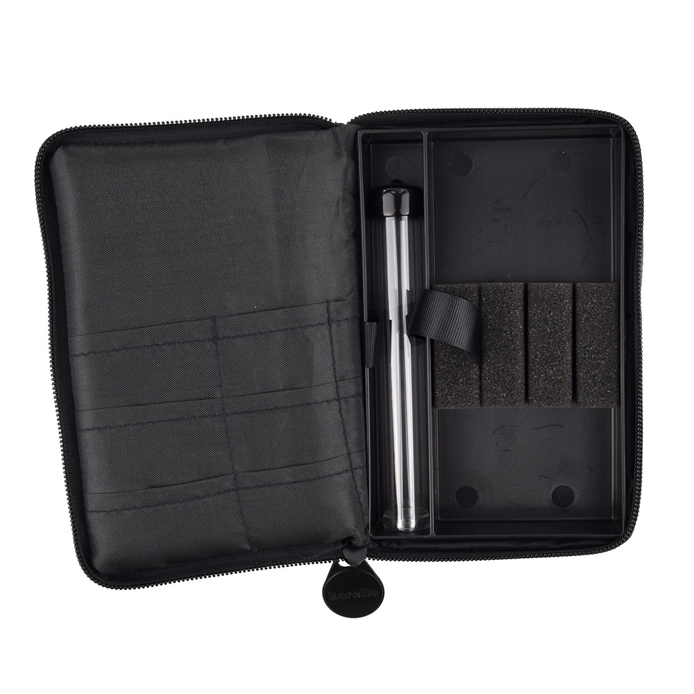 Karella 's 'The Pak' dart bag, open. Three fabric compartments on the left. On the right, a black PVC insert with a transparent tube for dart tips and four foam blocks for securing two assembled darts. Internal layout shown without contents.
