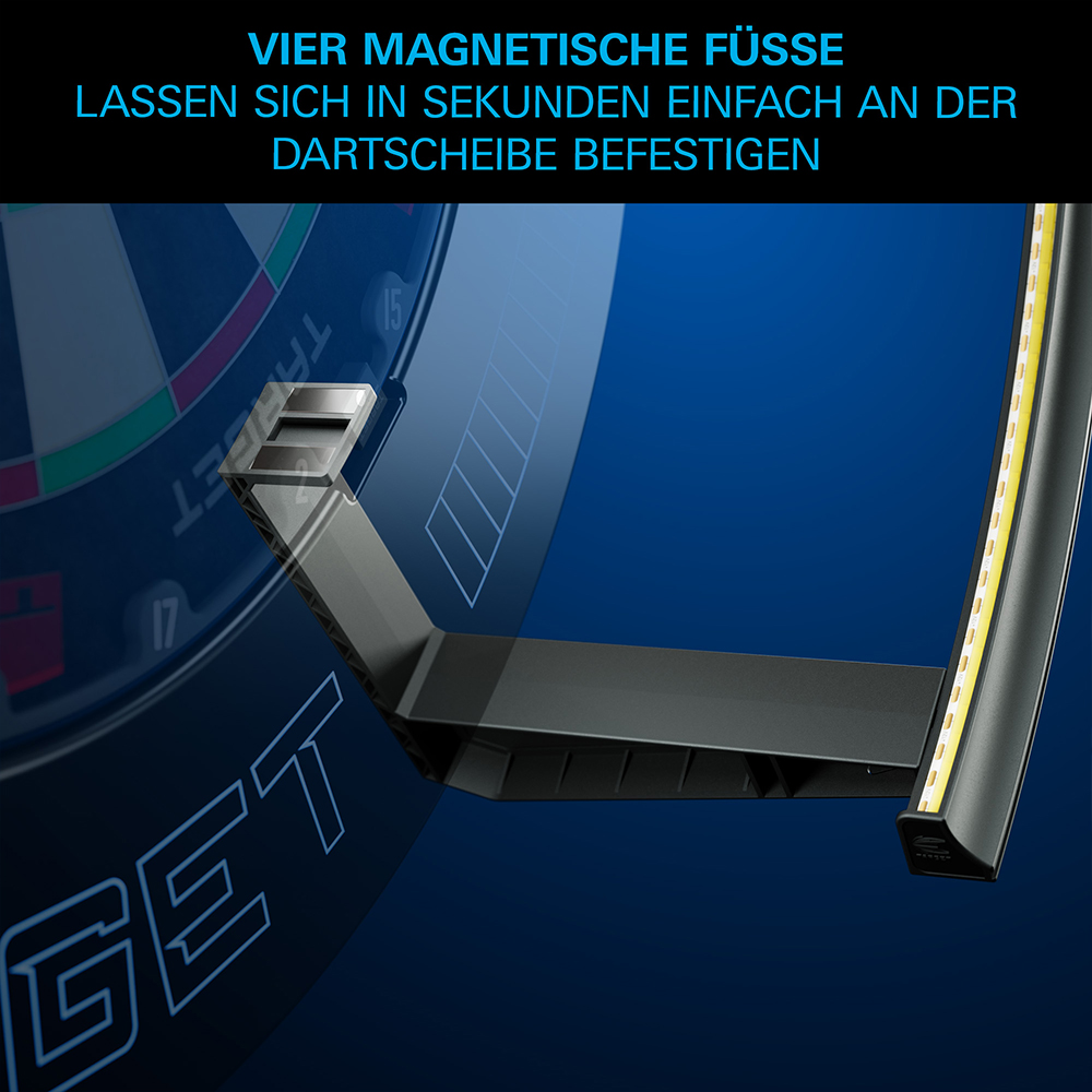 Vue détaillée du système d'éclairage pour cibles de fléchettes Corona Vision 2 de Target, avec fixation : un bras sombre de l'anneau LED est fixé à la cible via un socle magnétique. Montage simple et sûr.