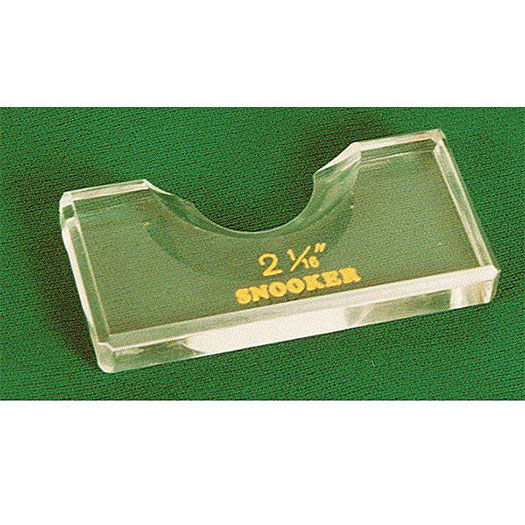 Transparent, rectangular acrylic position marker for snooker balls on green baize. Features a curved, concave recess at the top. Below this, gold embossing reads '2 1/16"' and 'SNOOKER' to indicate the ball size. Marks the exact ball position.
