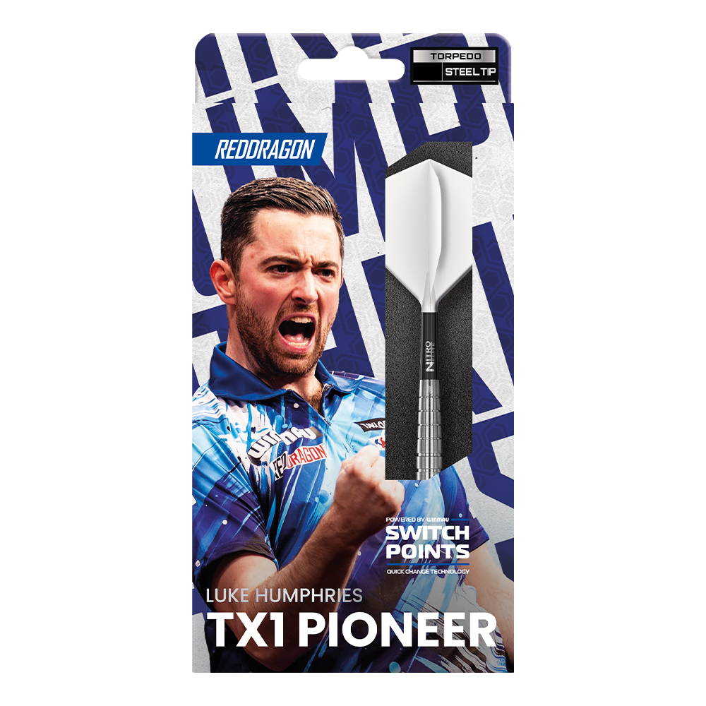Close-up of darts player Luke Humphries in a blue and white patterned jersey, celebrating with his mouth open and his fist clenched. Next to him is a single silver dart tip with white flights in its packaging, featuring dynamic blue accents.