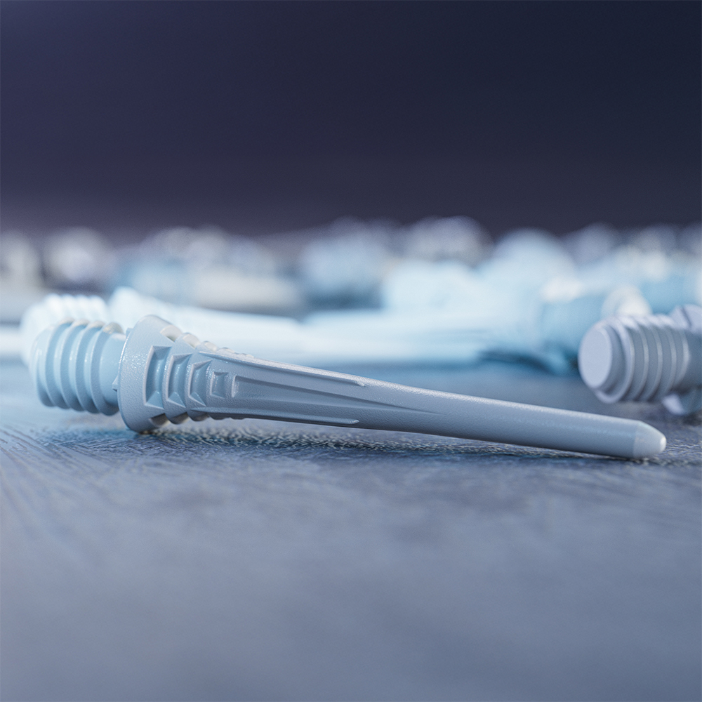 Une pointe de fléchette souple blanche « Target » Cryo est mise en avant sur une surface sombre. Elle est effilée à l'avant, légèrement conique, et présente à l'arrière un filetage 2BA strié pour la fixation.