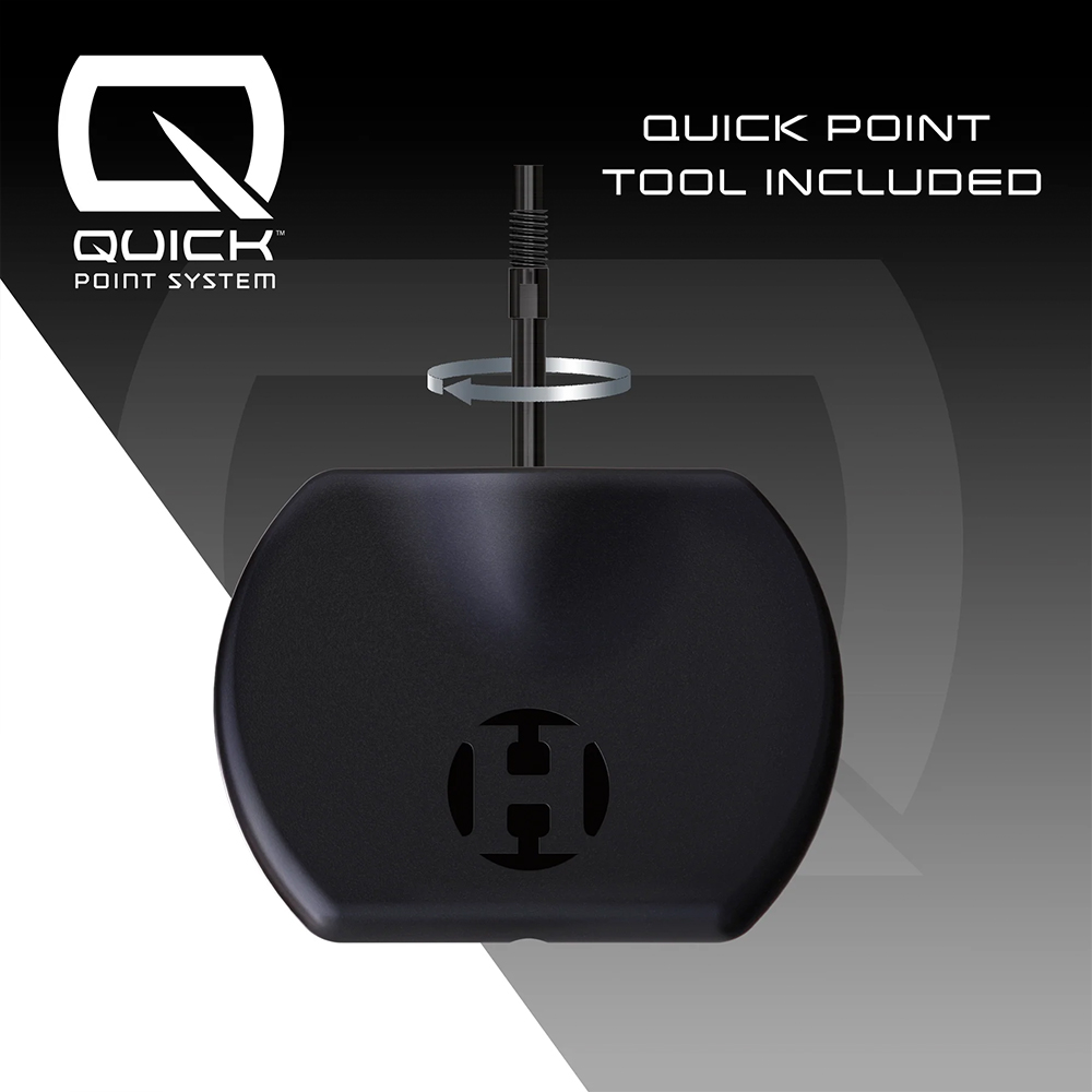 A black ‘ Harrows ’ Quick Point Tool for quickly adjusting steel dart tips. It shows a dart tip being inserted into the tool and secured or released with a twisting motion, illustrating the Quick Point technology.