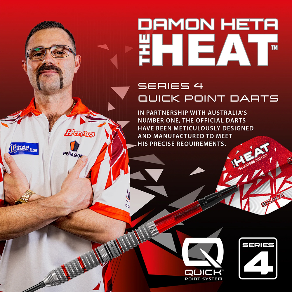 Damon Heta, a darts player with glasses and a distinctive moustache, gives a thumbs-up with his arms crossed. Next to him lies a Series 4 Harrows steel-tip dart with a red shaft and a “THE HEAT” flight. The dart features the Quick Point system.