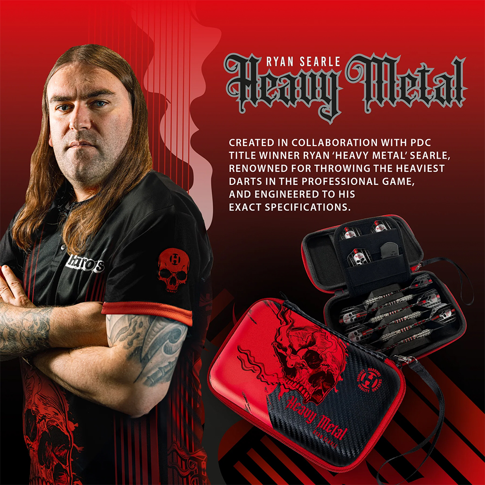 PDC professional Ryan Searle, with long brown hair and tattooed arms crossed, is wearing a black T-shirt featuring the ‘ Harrows ’ logo and a skull and crossbones pattern. Next to him is an open red and black dart case with a skull and crossbones design.
